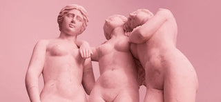 Three pink nude female statues